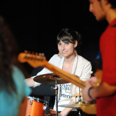 Drummer sitting at drums