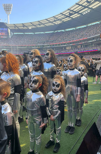 KISS performers waiting to commence their dance routine at the 2023 AFL Grand Final